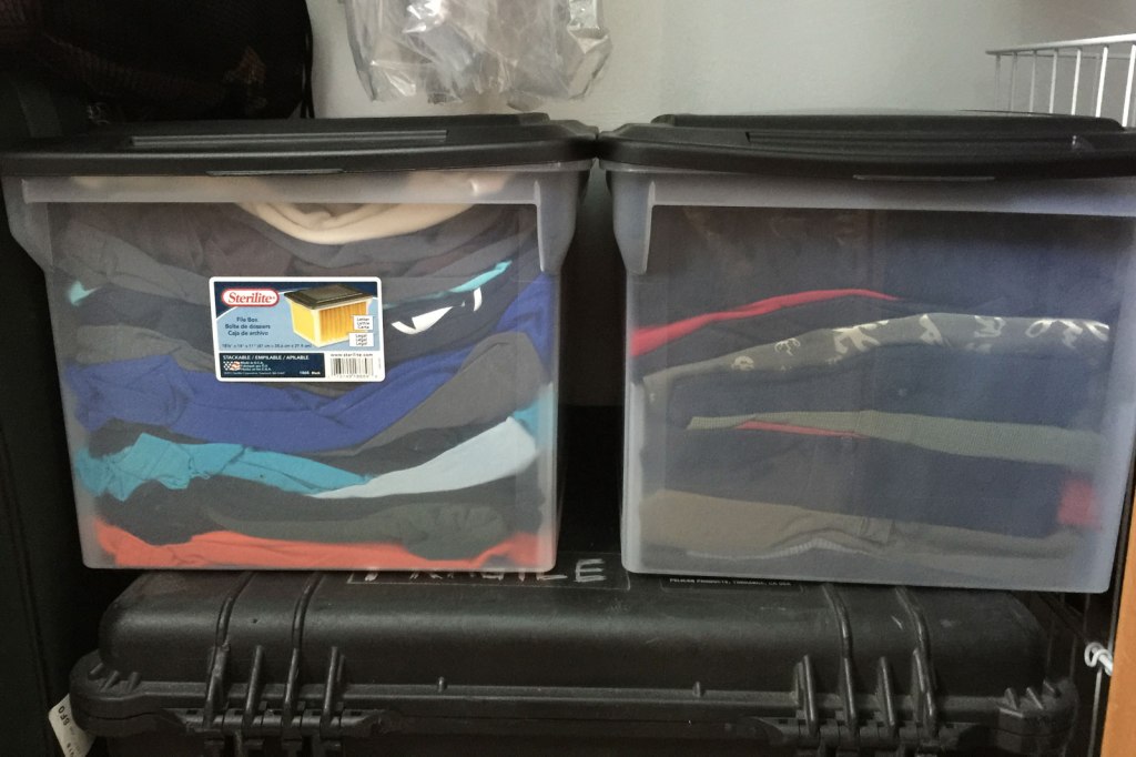 Two plastic bins hold the majority of the clothes I used to wear.