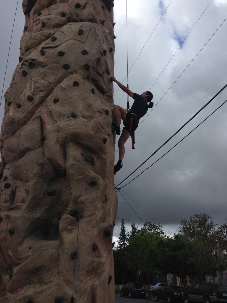 Climbing the wall outside Brick House Fitness in San Jose, CA.