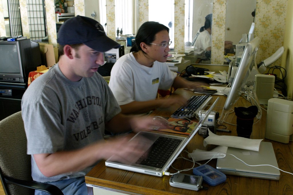 Furiously typing away on our keyboards for the camera’s sake on February 26, 2003. 
