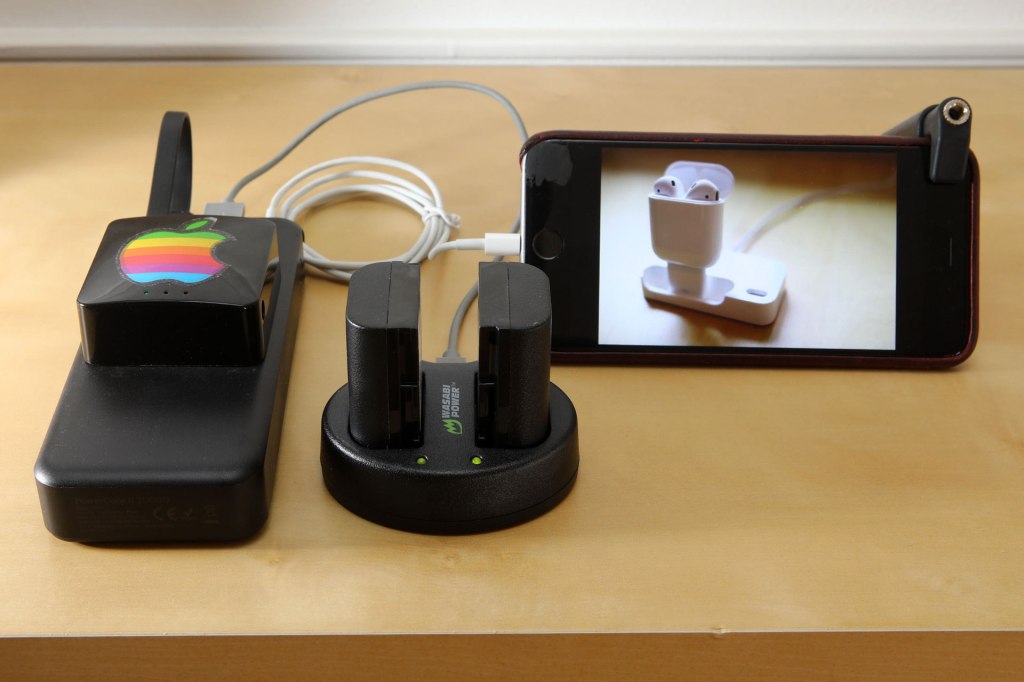 The Anker PowerCore II 20000 Portable Charger powers the Wi-Fi travel router, the dual LP-E6 battery charger, and the iPhone.